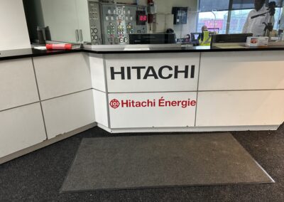 interior reception desk signage hitachi program global brand implementation TISA